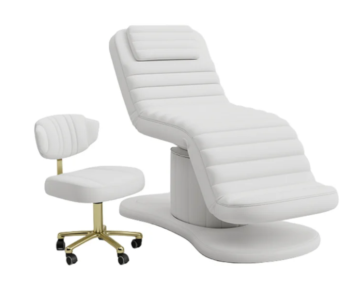 White electric facial bed with matching esthetician stool featuring a gold rolling base