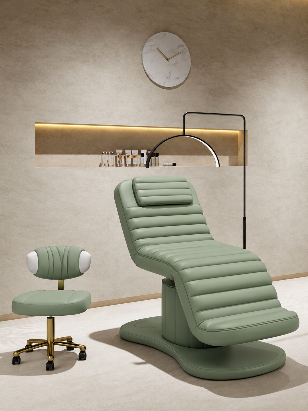 Sage green electric facial bed with matching esthetician stool featuring a gold rolling base